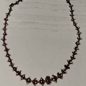Unique 22in brown, white and gold beaded necklace.